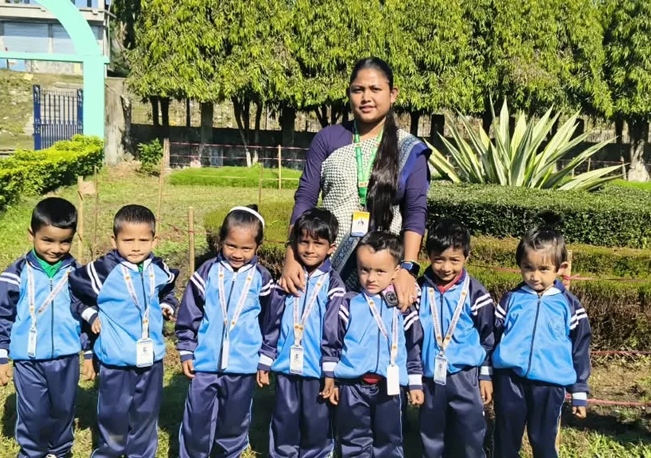 Young pupils with a teacher outdoors