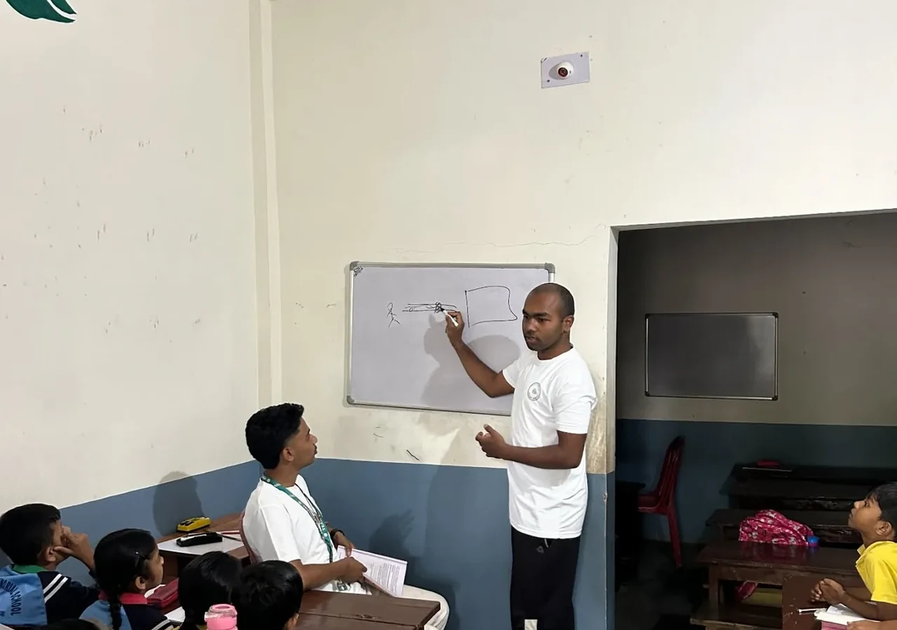Teacher leading a classroom lesson