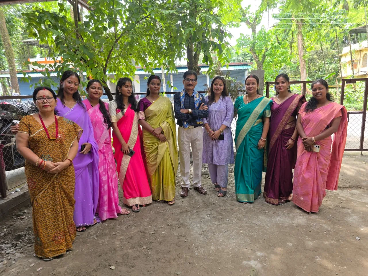 MGM staff members wearing colourful traditional clothes together outdoors